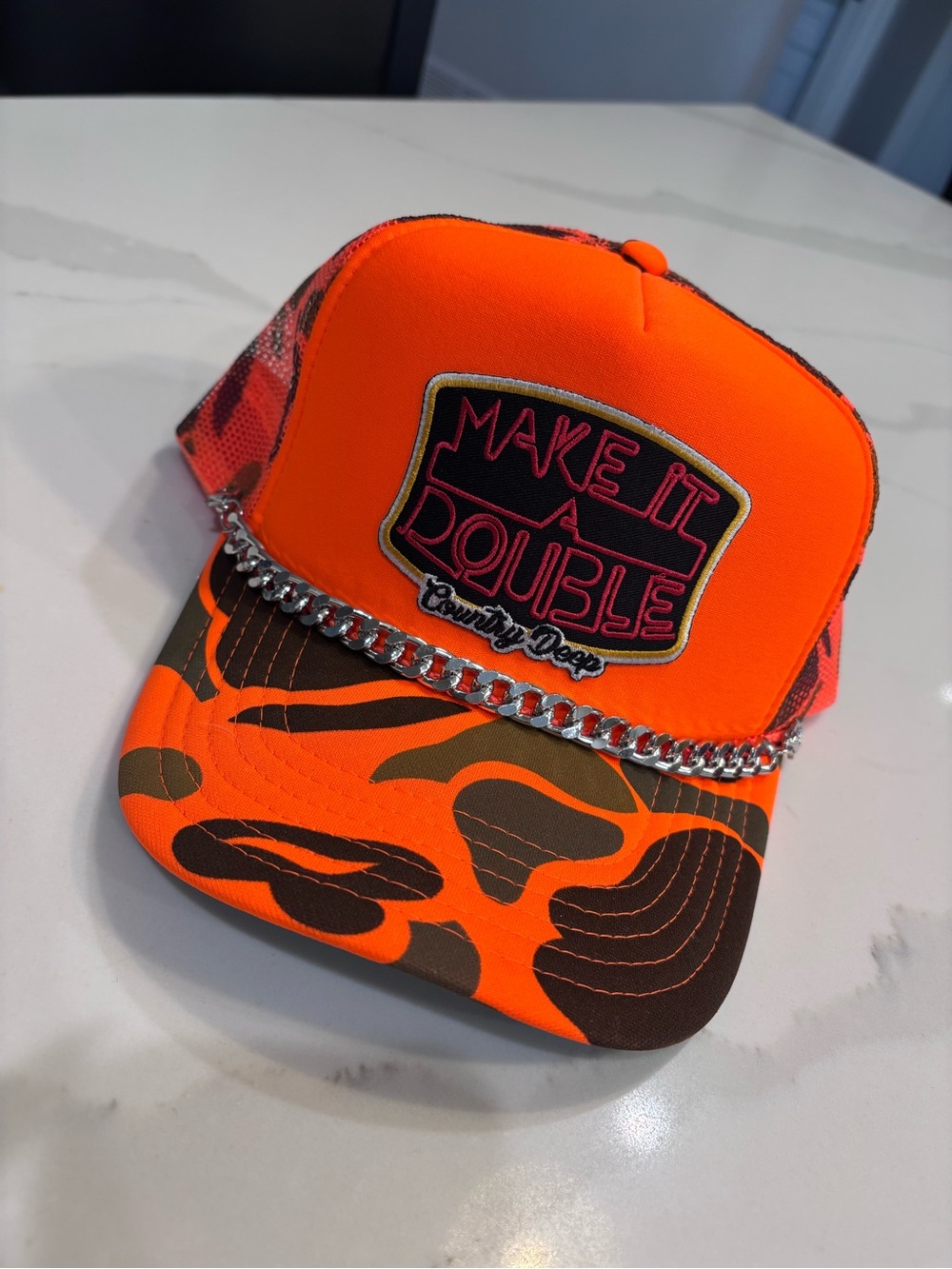 Make It A Double Orange Camo Trucker Hat with Chain